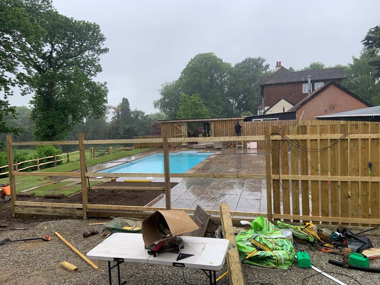 This is a photo of Bespoke custom fencing installed around a swimming pool by Fast Fix Fencing Thetford