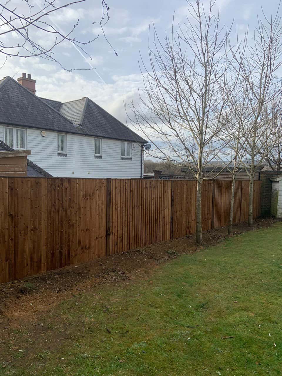This is a photo of feather edge fencing installed in a residential properties garden by Fast Fix Fencing Thetford